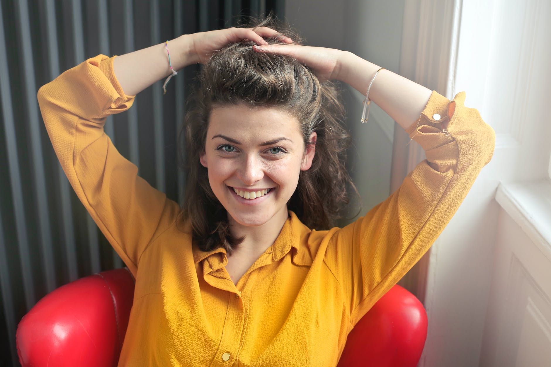 woman wearing yellow button up long sleeved dress shirt